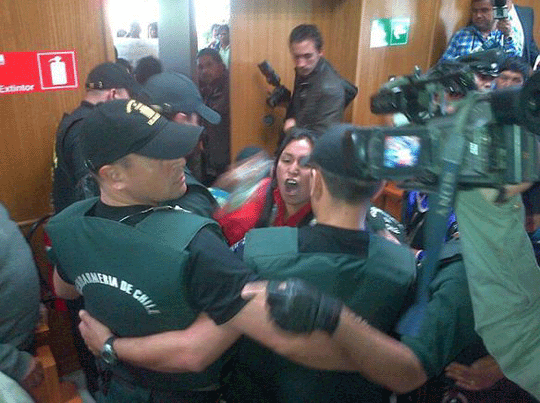 woman confronting prison guards