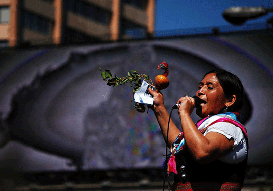 A mapuche lady with a microphone