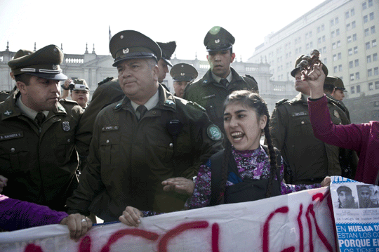 Mapuche natives protest in front of La Moneda, the presidential palace in Santiago