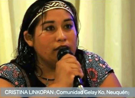 Lonko Cristina Lincopan speaking on a microphone