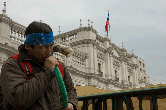 A Mapuche protester airs his grievances in front of La Moneda
